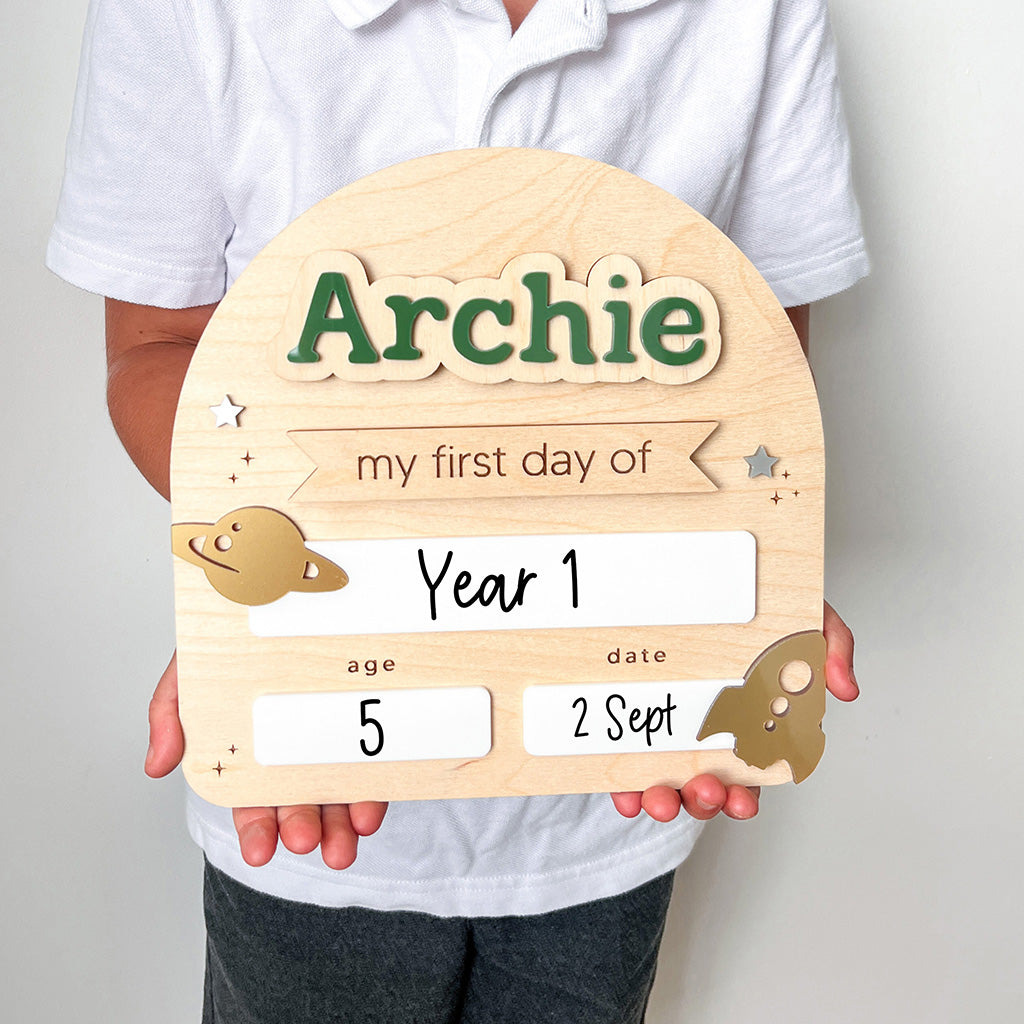 Wooden plaque with 'Archie' and placeholders for 'my first day of Year 1', age, and date.