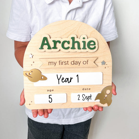 Wooden plaque with 'Archie' and placeholders for 'my first day of Year 1', age, and date.