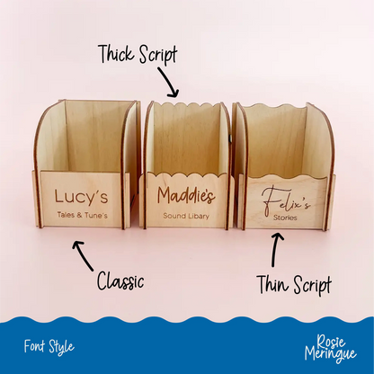 Empty personalised wooden Yoto card storage boxes showing the internal space and three front designs