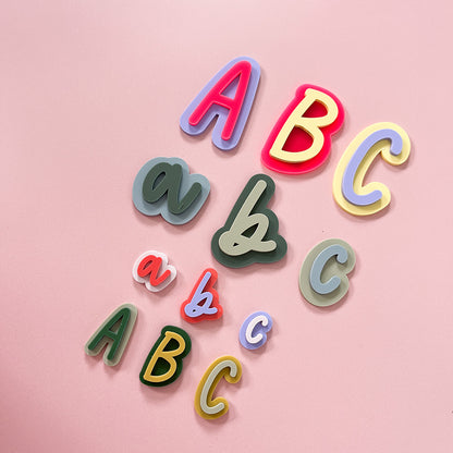 Colourful layered acrylic initial magnets with uppercase and lowercase letters