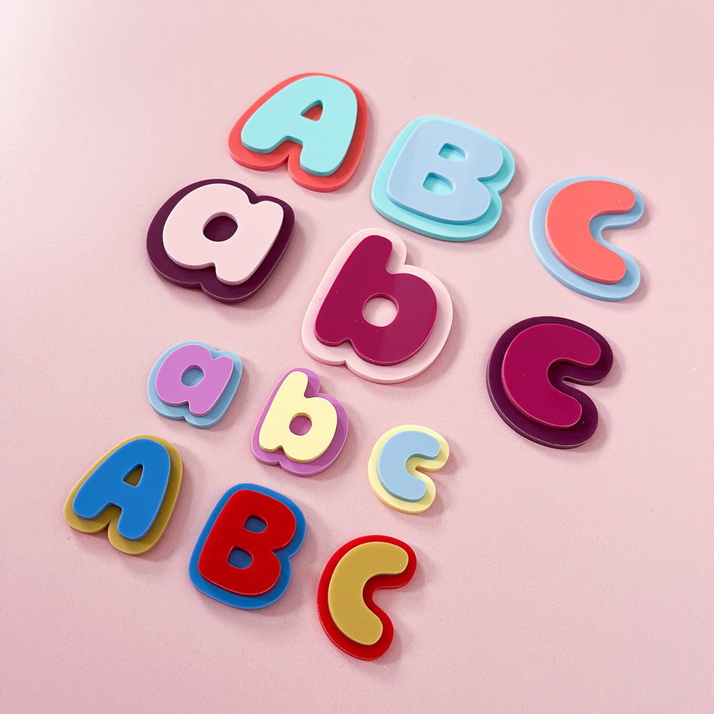 Small colourful acrylic letter magnets in uppercase and lowercase styles