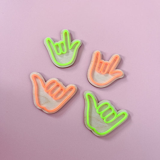 Neon green and orange hand sign wooden wall hooks for a colourful kids bedroom