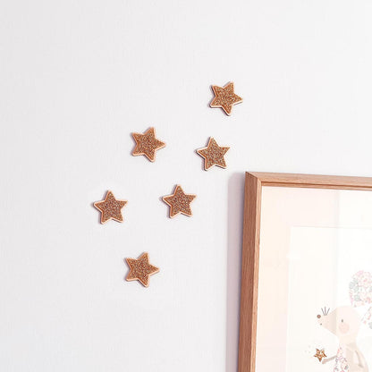 Gold glitter wooden star decorations for a nursery or children's bedroom