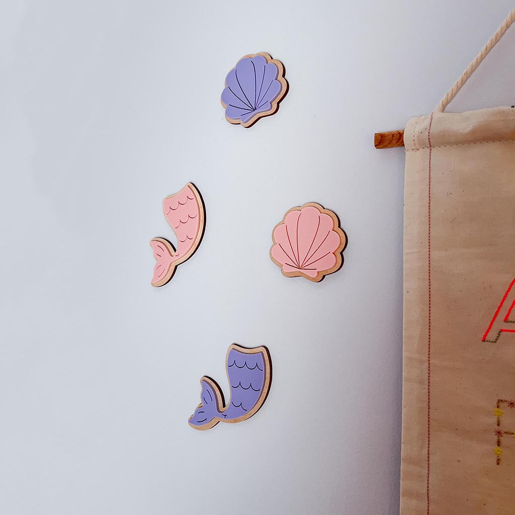 Pink and purple mermaid and shell wall decorations for a nursery or bedroom