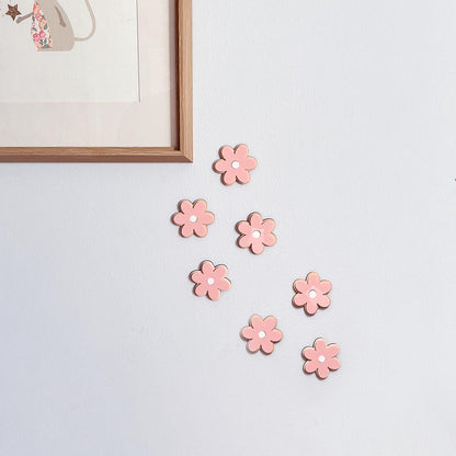 Pink wooden and acrylic flower wall decorations for a child's bedroom