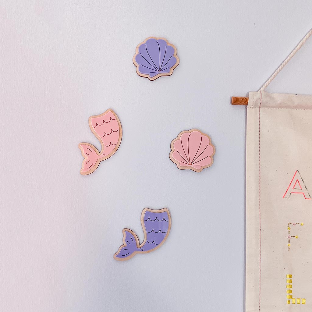 Wooden mermaid tail and seashell wall decor in pink and purple